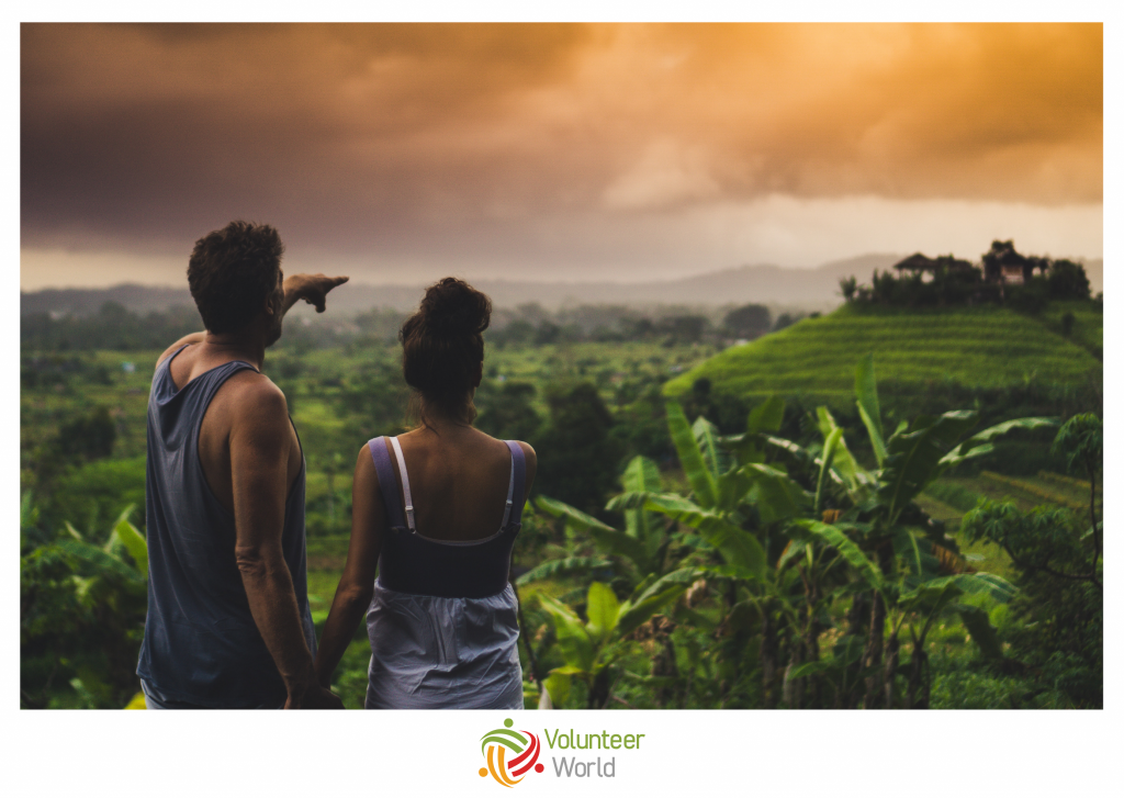 Couple looking at horizon over forest in Bali